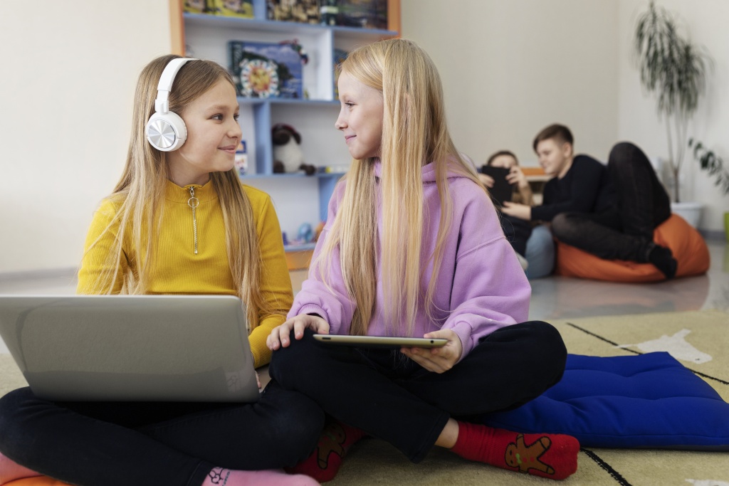 two-young-girls-working-together-using-their-laptop-tablet.jpg two-young-girls-working-together-using-their-laptop-tablet.jpg